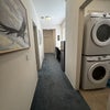 Photo 8: laundry, kitchenette with counter, cooktop, kettle, new refrigertor, sink, vaccum, etc.  