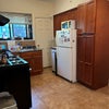 Photo 4: Eat-in Kitchen. A dining table not captured here is on the right side.
