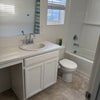 Photo 5: Shared bathroom between the two upper rooms 