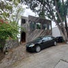 Photo 2: Front of house w parking spot