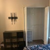 Photo 3: TV mount,  closet, and compact  dresser. 