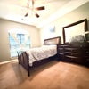 Photo 2: Your bedroom includes queen, bed, full dresser, nightstand