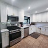 Photo 6: Kitchen w/ gas stove