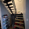 Photo 2: Stairs leading to second floor with storage beneath