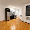 Photo 2: Kitchen/ Salon Area