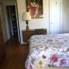 Photo 2: bed, desk, door, closet in bedroom