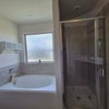 Photo 2: Master en suite bath with double sink, full tub and tile shower
