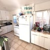 Photo 4: furnished kitchen, gas stove, toaster oven, microwave, dishwasher