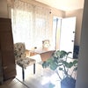 Photo 6: comfy white chairs with a bamboo, extending table 