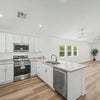 Photo 4: Brand new stainless steel appliances