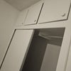 Photo 2: Closet with top shelves for linen