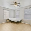 Photo 4: primary bedroom unit, full bed and fully furnished