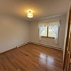 Photo 2: Rental bedroom: unfurnished, hardwood floors, lots of natural light, baseboards, closet space