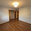 Photo 3: Rental bedroom: unfurnished, hardwood floors, lots of natural light, baseboards, closet space