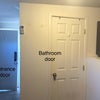 Photo 4: Bathroom door and short entryway 