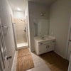 Photo 2: Private bathroom for downstairs bedroom