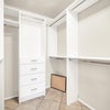 Photo 9: Master bedroom walk in closet organization system