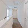 Photo 9: upstairs hallway facing master 