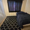Photo 3: Bed is queen sized.