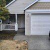 Photo 4: Porch and driveway with garage.