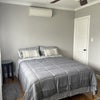 Photo 3: Mini split a/c in room - closet to right of bed