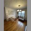 Photo 7: Kitchen common space, couch and table, trees outside window