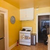 Photo 8: Kitchen with solid wood cabinets.