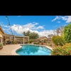 Photo 4: Back yard with pool, covered swing and pizza oven