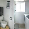 Photo 5: One of the bathrooms (plus laundry)