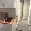 Photo 5: View from bedroom into kitchen and laundry room