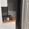 Photo 9: View of bath room/inclides sink and stove, running water, all new never used! 