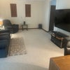 Photo 8: This is the Theater Room with massage sofa, recliners, and desk/chair