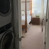 Photo 2: Third floor bedroom showing laundry closet