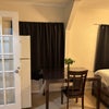 Photo 2: Refrigerator snd kitchen table