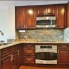 Photo 4: Kitchen with electric stove, dishwasher 
