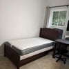 Photo 1: Bedroom with window view, bed and table and chair furnished