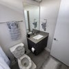 Photo 6: Nice private bathroom new toilet seat new rugs and decorative towels and shower curtain etc 