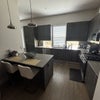 Photo 3: Island for eating in chefs kitchen with natural lighting and under cabinet lighting at night 