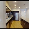 Photo 7: entrance door and large refrigerator 
