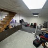 Photo 5: Basement with storage and laundry. 