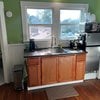 Photo 5: Fully stocked kitchenetter with hot plate, air fryer oven and microwave
