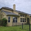 Photo 7: corner lot, fenced backyard, patio with roof and net