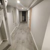 Photo 2: Hallway next to kitchen towards the rooms