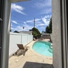 Photo 5: View from downstairs door to the patio