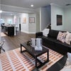 Photo 6: View of the shared living room, kitchen, and dining area.