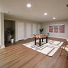 Photo 8: 1st floor has a basement with extra storage space and a bonus room
