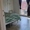 Photo 8: Small room off yard, sliding door. Covered spot outside