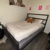Photo 5: Photo taken at night. Room comfortably fits a full size bed. Queen size bedfram shown in images. 
