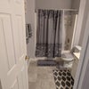 Photo 8: Lower-level shared bathroom