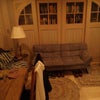 Photo 5: living area in suite, with futon and bookshelves